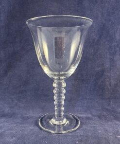 Leerdam glasfabriek bitterglas hoog 10 cm Ø 5,7 cm. Ontworpen door K.P.C. de Bazel.