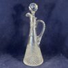 Kleine kristallen karaf met stop en handvat hoog 24,5 cm. Wilhelmina slijpsel  Hand geslepen kristal